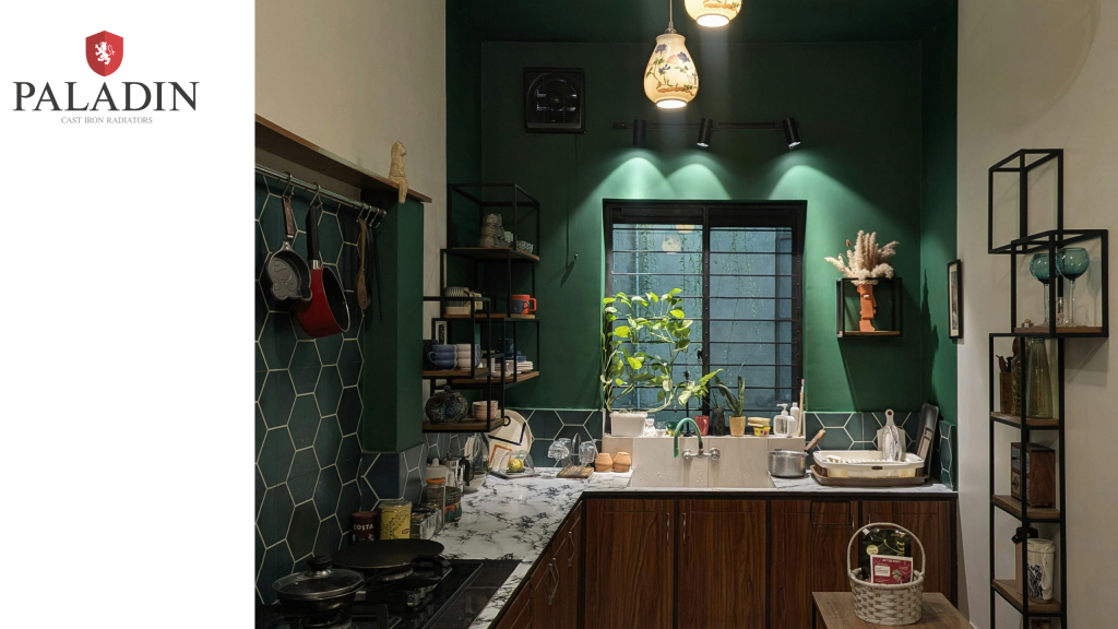 Modern kitchen with dark green walls, hexagonal splashback tiles, pendant lights, wooden cupboards, a window, and various kitchen items on the counter and shelves. Paladin logo on left.