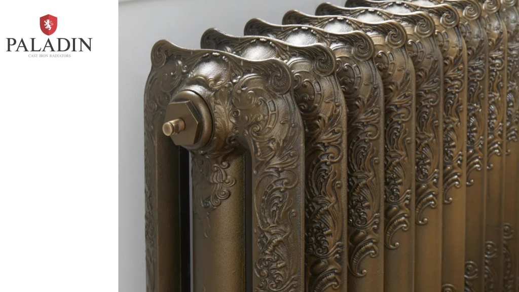 Close-up of an ornate, vintage-style cast iron radiator with intricate floral designs, next to the Paladin logo on a white background.